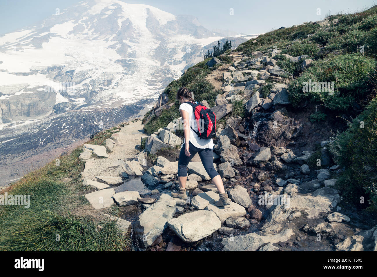 Woman hiking, Glacier Basin Trail, Mount Rainier National Park, Washington, United States Stock Photo