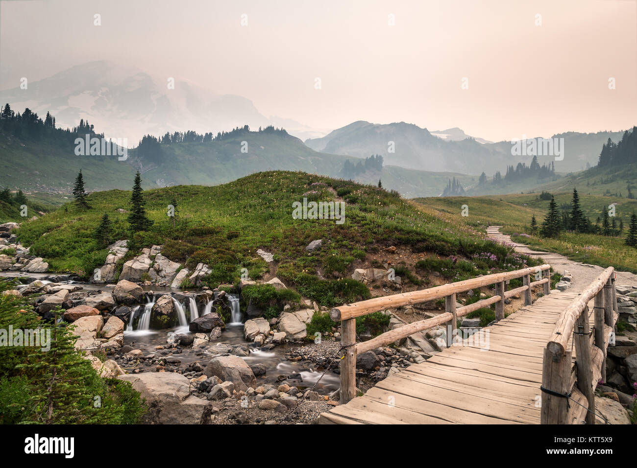 Hiking path at Mt. Rainier National Park with wildfires nearby, Washington, United States Stock Photo
