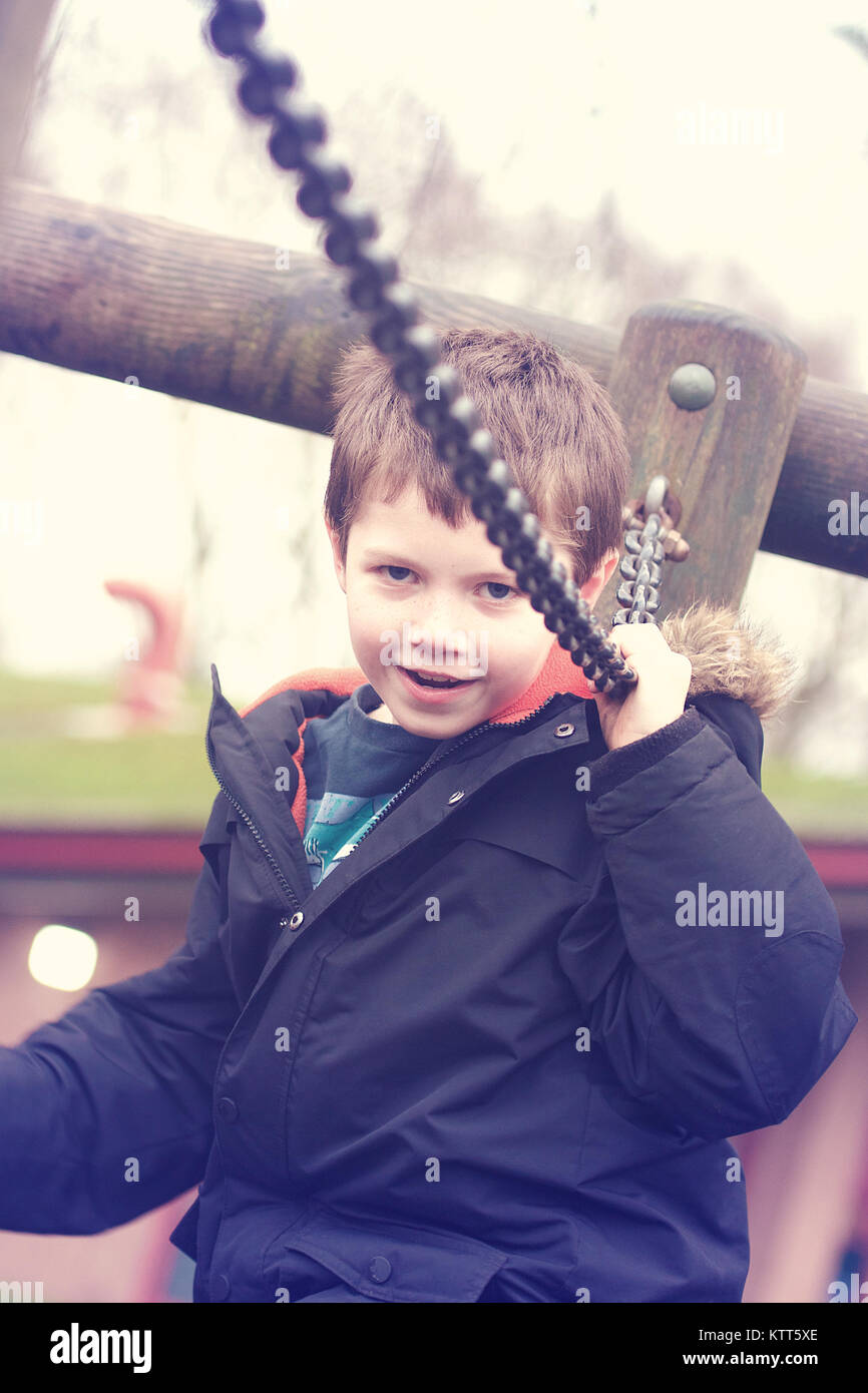 Boy playing at a playground Stock Photo