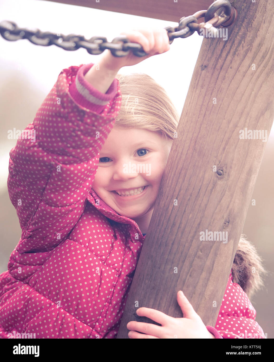 Girl playing in a playground Stock Photo