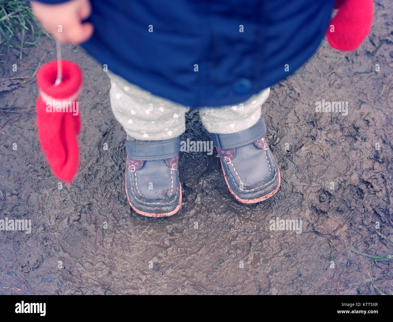 Close-up of a Girl's legs standing in a mud Stock Photo