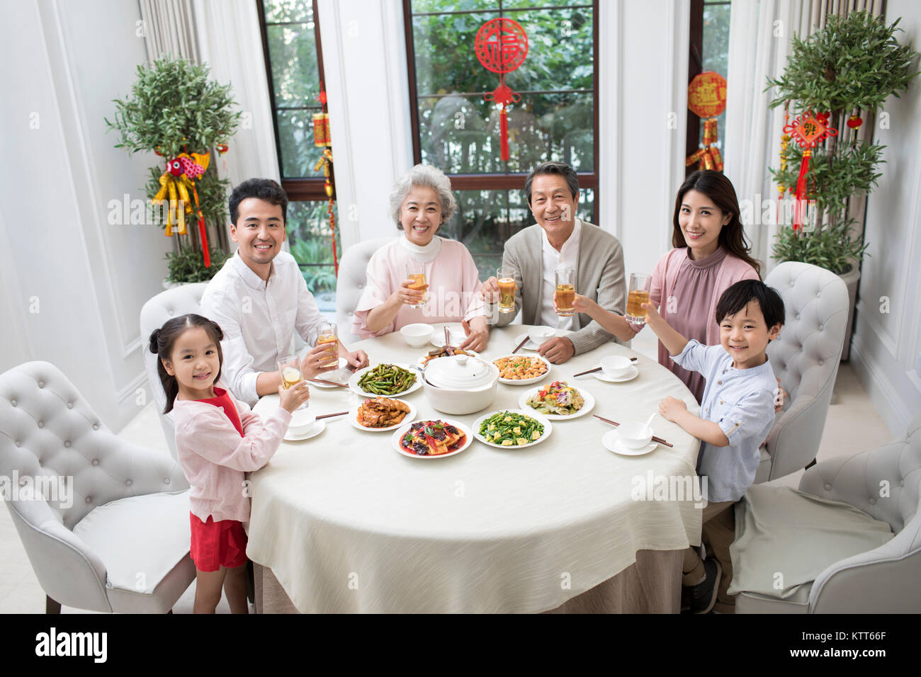 Happy family having Chinese New Year dinner Stock Photo