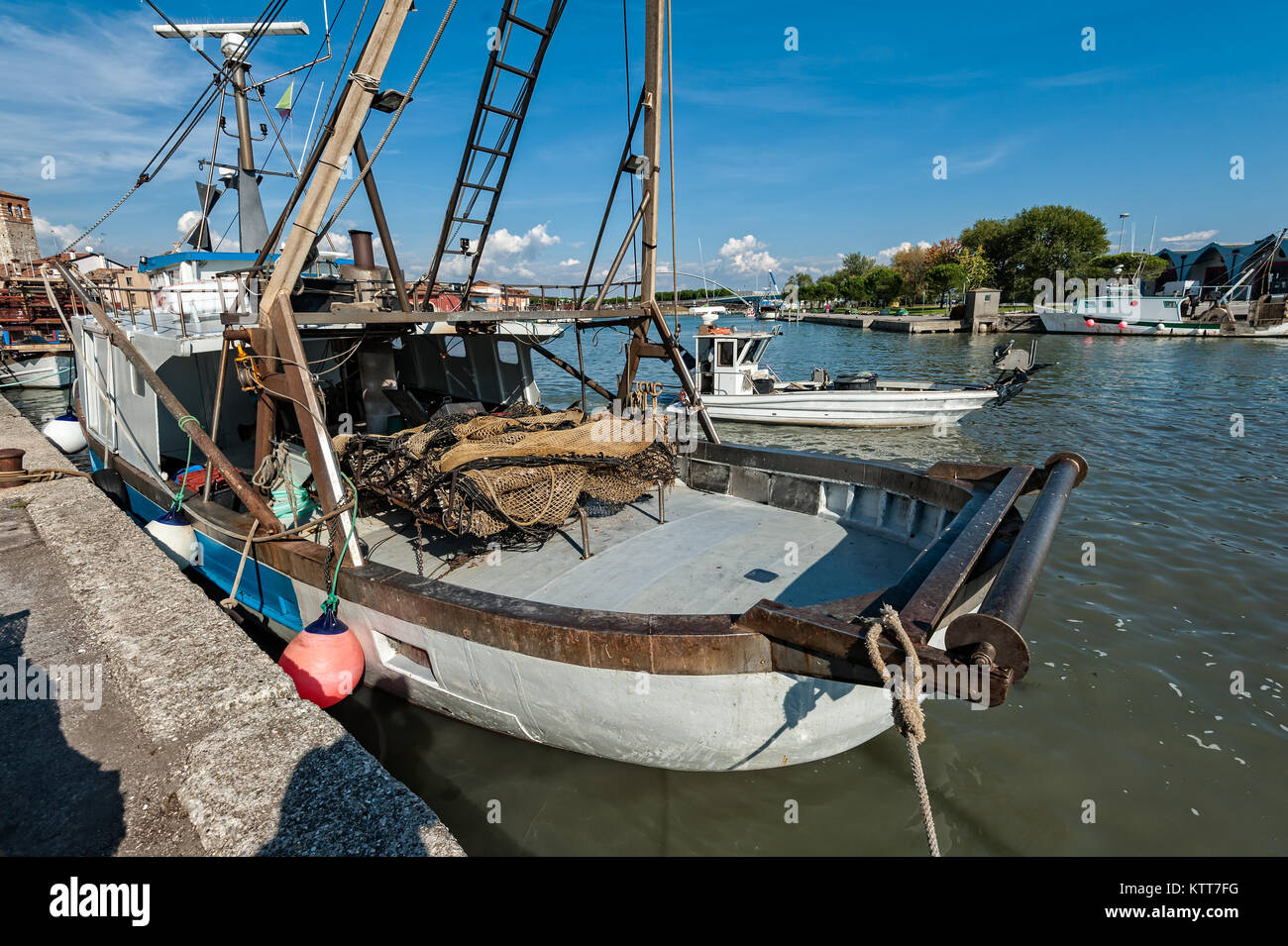 Commercial fishing boats moored in harbor. Stock Photo
