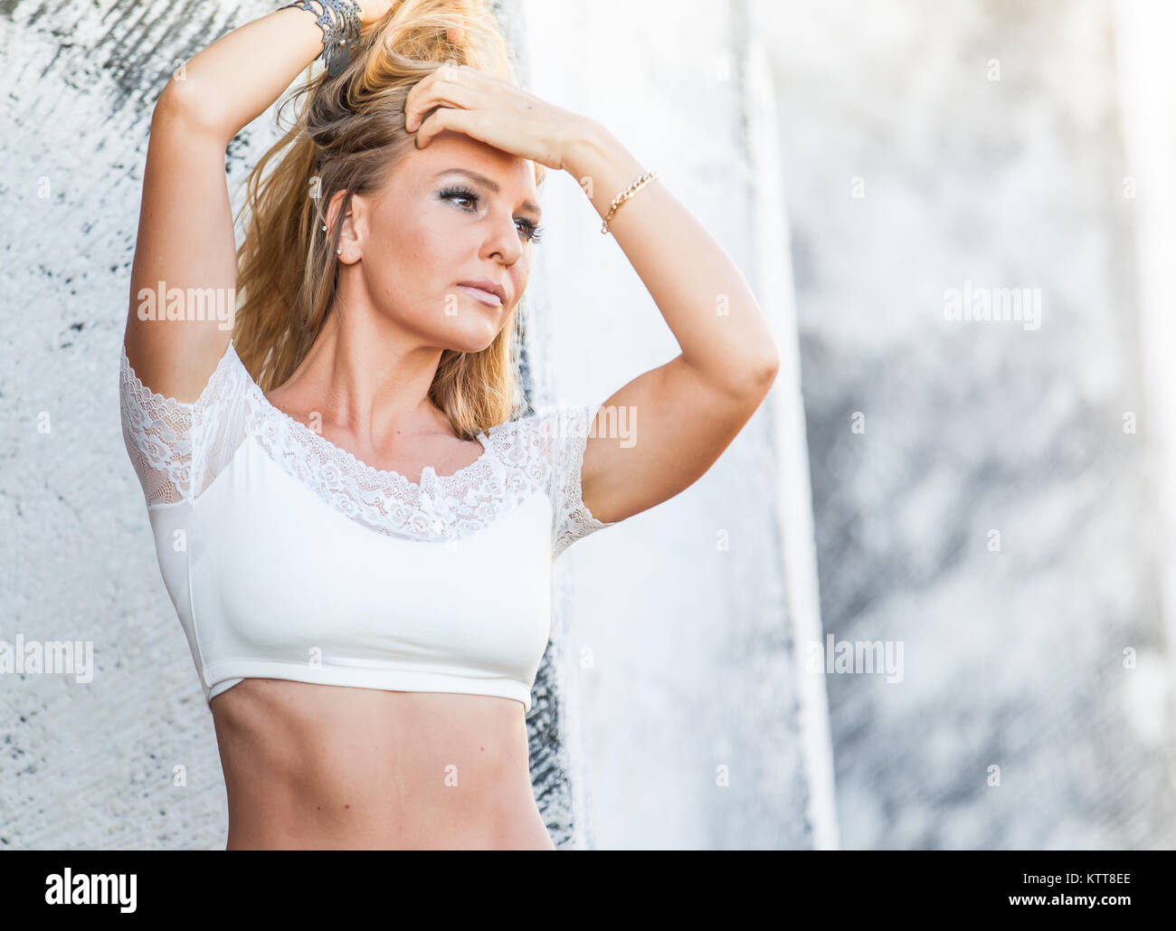 City girl fitness model playing with her hair, emotional Stock Photo