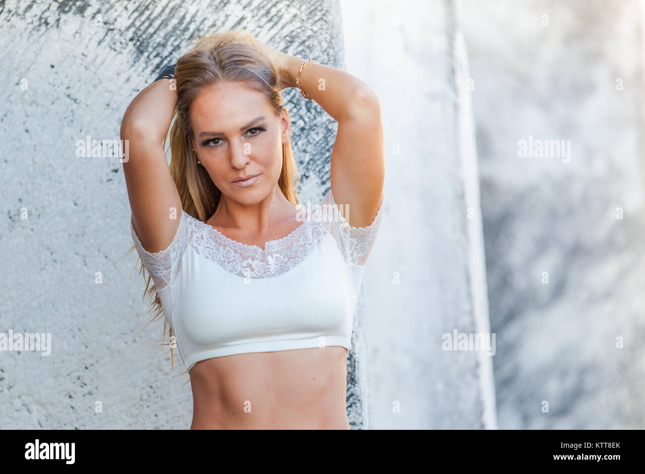 City girl fitness model playing with her hair, emotional Stock Photo