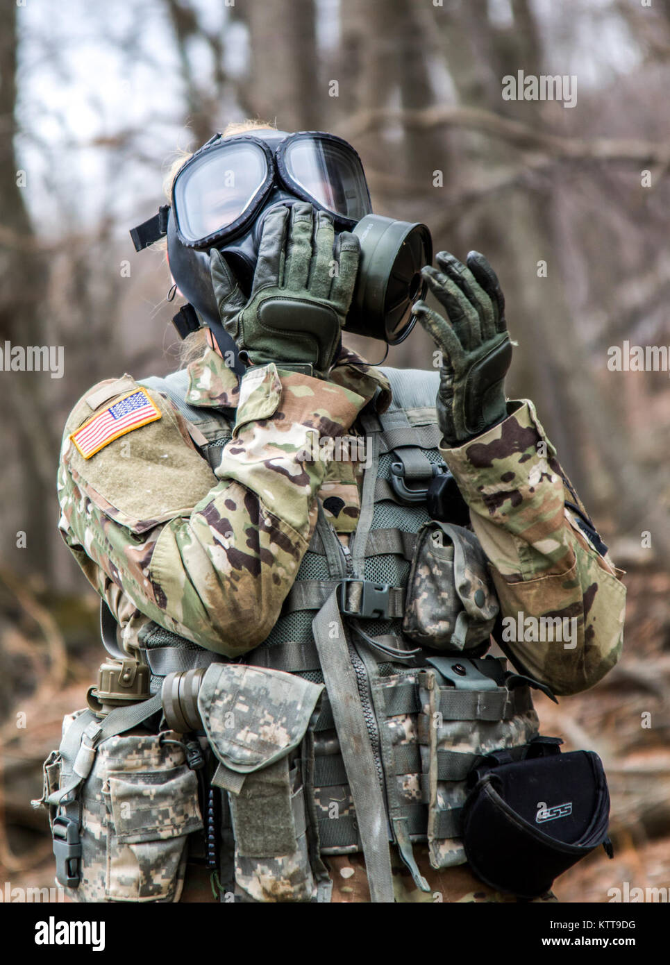 U.S. Army Spc. Courtney Natal dons her protective mask before firing an M9  pistol during the New York Army National Guard Best Warrior Competition at  Camp Smith Training Site March 30, 2017.
