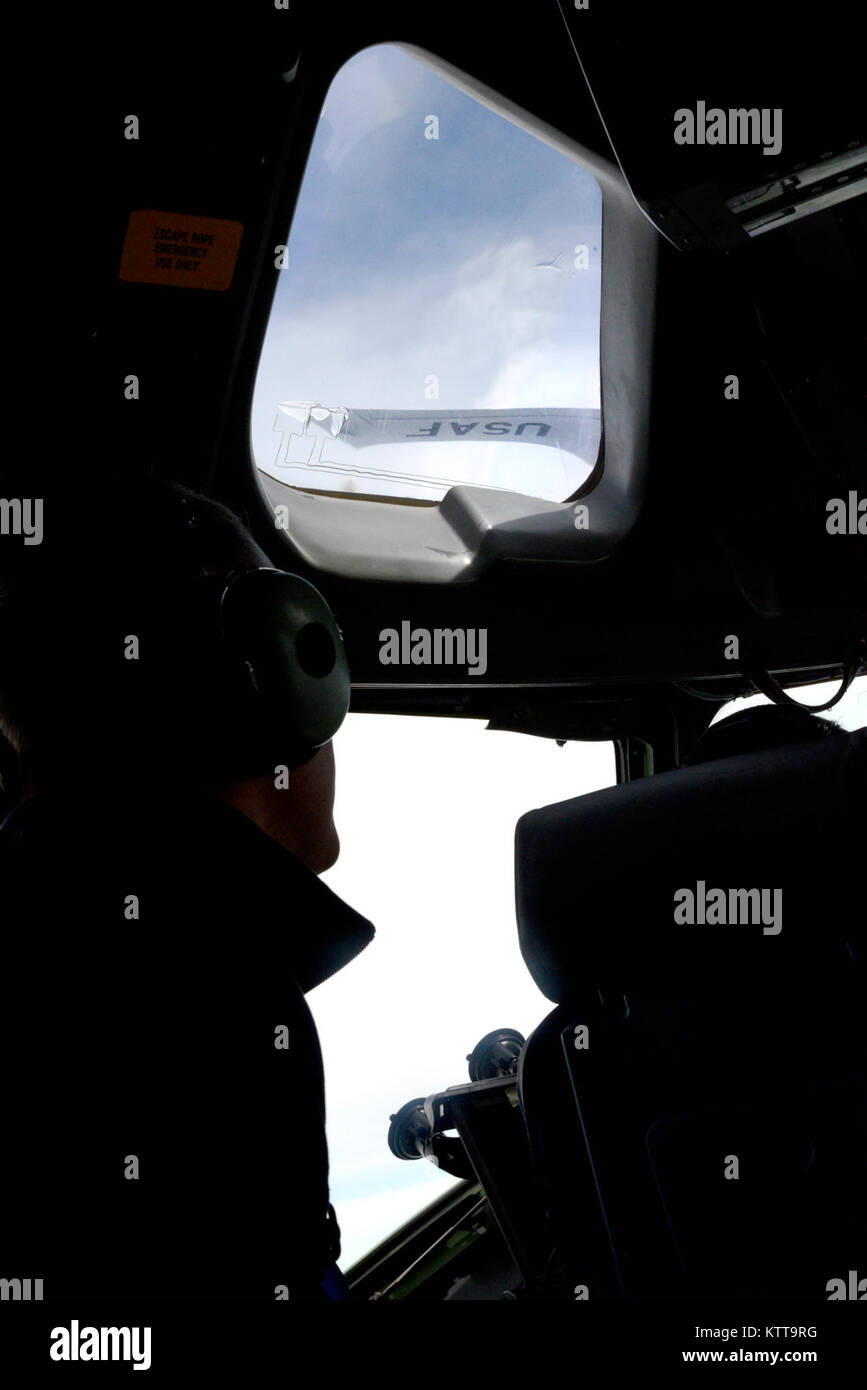 U.S. Rep. Sean Patrick Maloney looks up at a KC-135R Stratotanker, assigned to the 141st Air Refueling Squadron, 108th Wing, New Jersey Air National Guard, during in-flight refueling of a C-17 Globemaster III based at the 105th Airlift Wing, Stewart Air National Guard Base, New York April 20, 2017.  Maloney was visiting Stewart to sign a Statement of Support letter to promote employer support for the Guard and Reserve and tour the facilities. (U.S. Air Force photo by Master Sgt. Sara A. Pastorello) Stock Photo