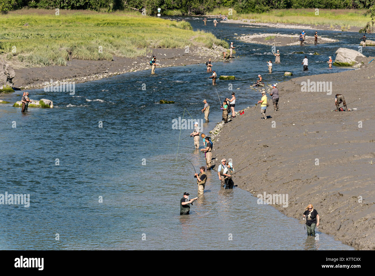 Dozens of people snag fish for silver salmon in summer along Potter