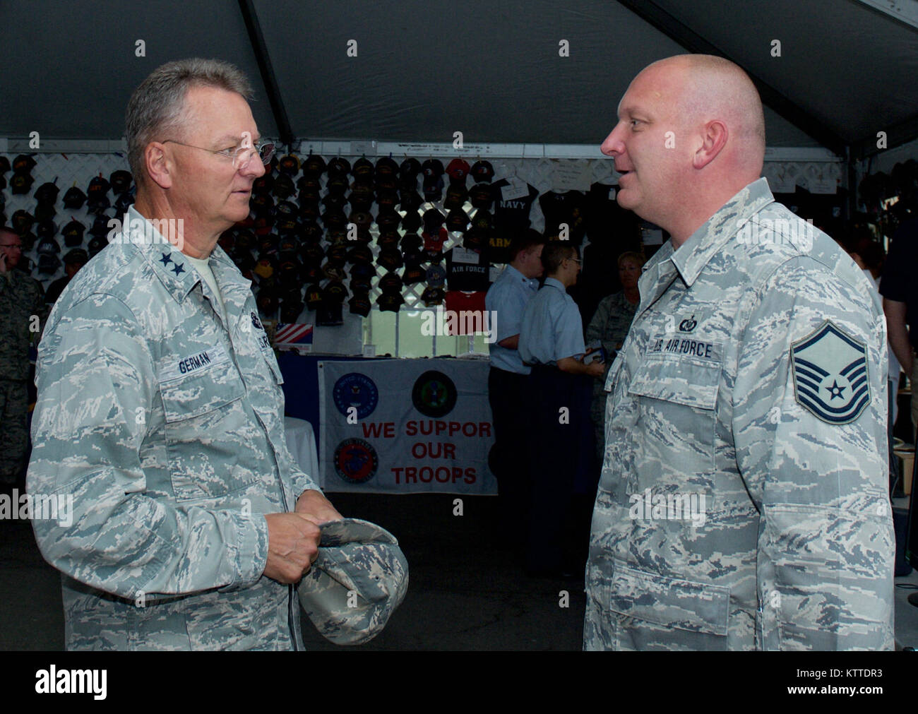 Major General Anthony German, the Adjutant General of New York, talks with Airman of the 174th Attack Wing during a visit to the New York Air National Guard exhibit at the New York State Fair in Syracuse, N.Y. on August, 31, 2017. The exhibit includes a display of equipment used by Air Force Security Forces, inert weapons, meterology equipment, and the mockup of a ground control station used to control the MQ-9 remotely piloted aircraft. U.S. Air National Guard photo by Master Sgt. Lillque Ford. Stock Photo