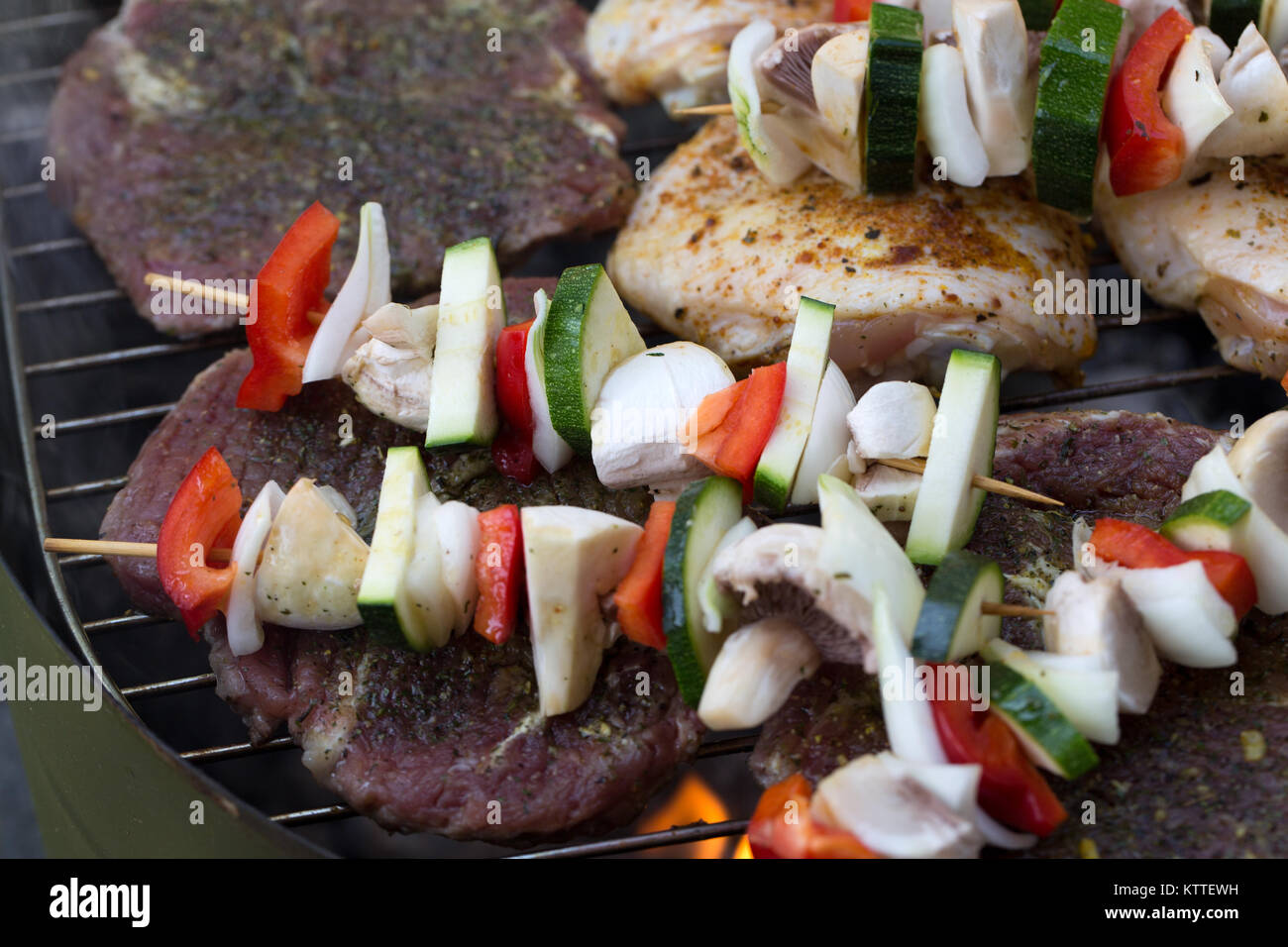 barbecue with delicious grilled meat and vegetables on grill Stock ...