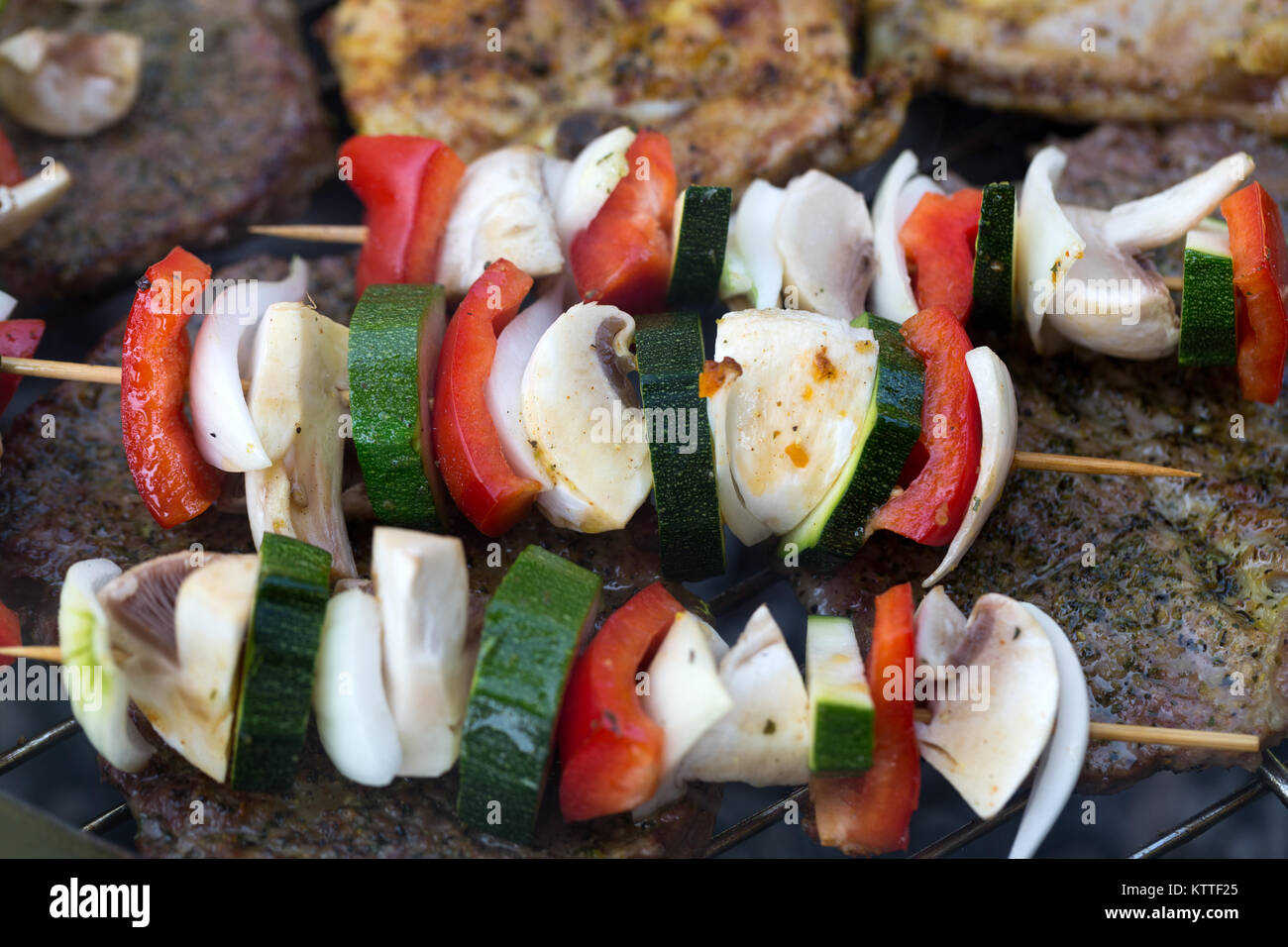 barbecue with delicious grilled meat and vegetables on grill Stock ...