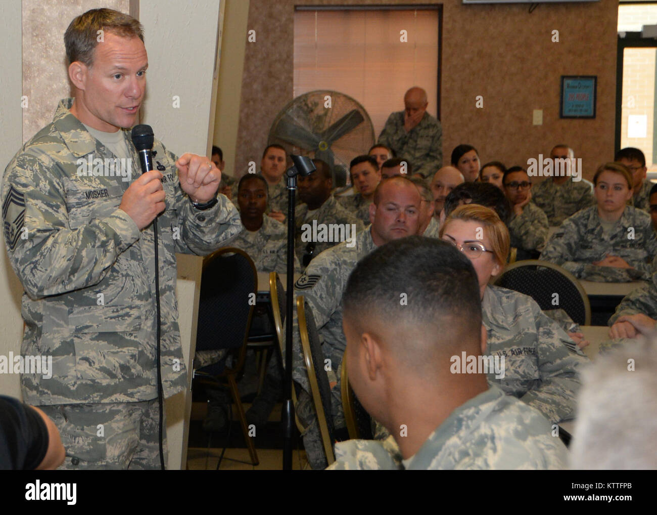 Chief Master Sgt. Brian A. Mosher, 106th Rescue Wing chief enlisted manager, introduces Chief Master Sgt. Harold L. Hutchison, command chief of the North American Aerospace Defense Command and U.S. Northern Command, during an enlisted all-call at the New York National Guard's 106th Rescue Wing in Westhampton Beach, New York on October 3, 2017. (U.S. Air National Guard photo by Airman 1st Class Daniel H. Farrell) Stock Photo