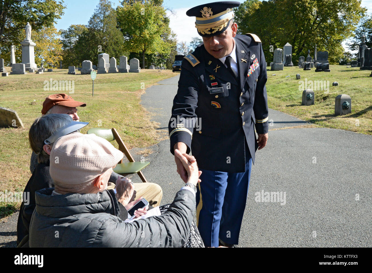 Colonel John Andonie, Chief of Staff of the New York Army National Guard, greets Albany Rural Cemetery Board member Norman Rice, following a ceremony honoring Chester A. Arthur, president of the United States from 1881 to 1885 at the cemetery in Menands, N.Y. on Oct. 5, 2017. The United States Military honors deceased presidents with a wreath from the sitting president at their gravesite on the anniversary of the past president's birth. Rice, an Albany resident, has served on the board for more than 30 years.( New York State Division of Military and Naval Affairs photo by William Albrecht) Stock Photo