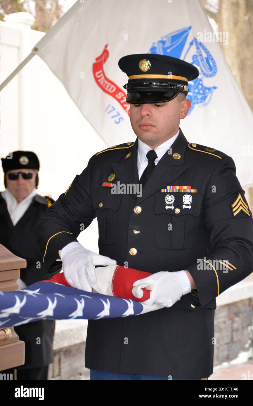 Robert Ramon Army New York Army National Guard Sgt. Ramon Rodriguez, folds a U.S. flag ...