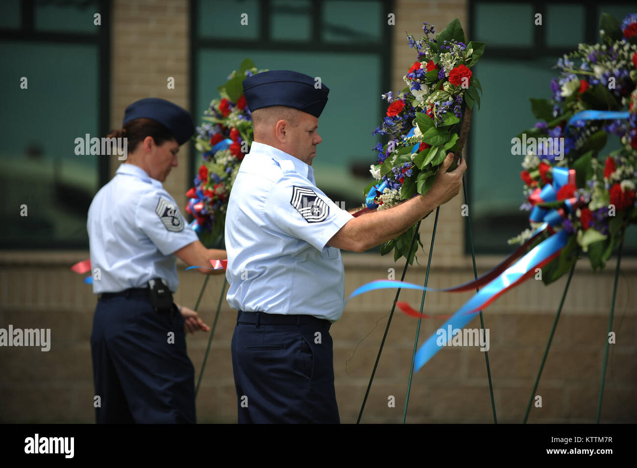 Members of the 106th Rescue Wing lay wreaths in rememberence of seven