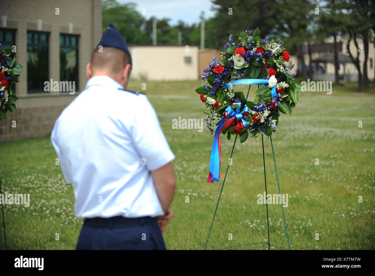 Members of the 106th Rescue Wing lay wreaths in rememberence of seven