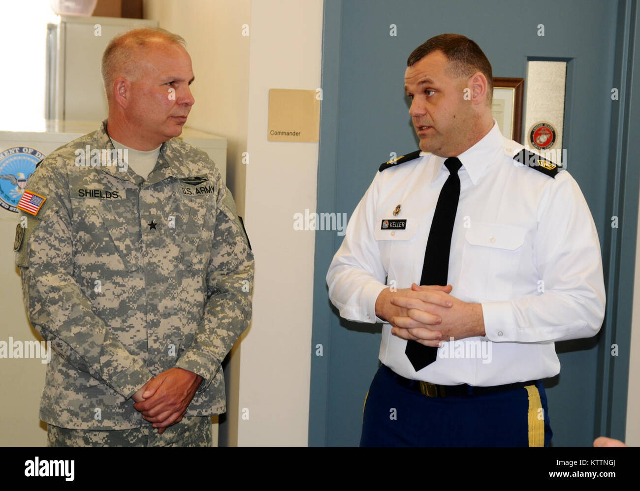 ALBANY, N.Y.-- First Sgt. Jason Keller, Senior Enlisted Advisor for the Albany, N.Y., Military Processing Station (MEPS) guides Brig. Gen, Raymond Shields, Director, Joint Staff, New York National Guard, on a tour of the station Feb. 25, 2013. Stock Photo