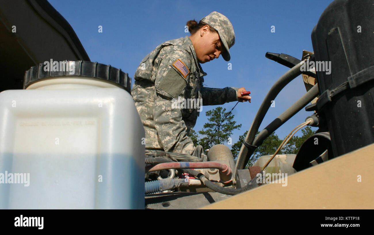 Private Lisa P. Holmes, of Cleveland, assigned to Alpha Co. 237th Brigade Support Battalion, 37th Infantry Brigade Combat Team, performs a pre-combat maintenance check on her Mine Resistant Ambush Protected (MRAP) vehicle during training at Camp Shelby Joint Forces Training Center, Miss., on Sept. 23, 2011. The brigade is deploying to Afghanistan in support of Operation Enduring Freedom. (Ohio National Guard photo by Spc. Kimberly Lamb) (Released) Stock Photo