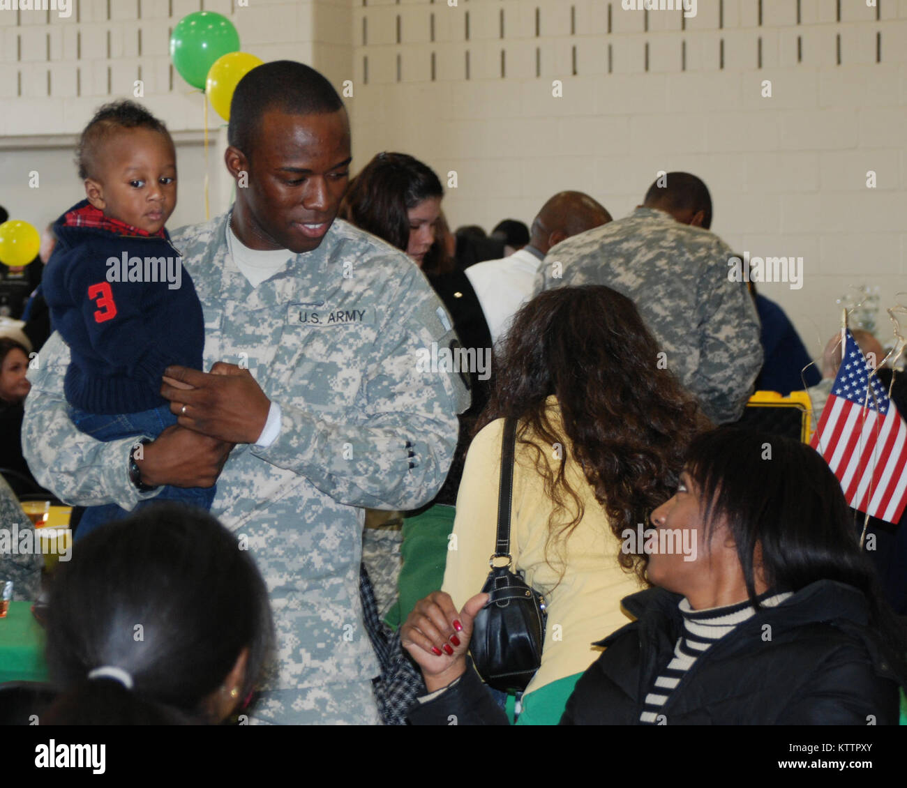 CAMP SMITH, Peekskill, N.Y. -- Soldiers and families of the 727th Military Police (Law and Order) Detachment vist during the units departure ceremony, Nov 27.  Hundreds of family members said farewell to 45 members of the unit.  The Soldiers departed for mobilization training at Ft. Bliss, Texas and will serve in northern Afghanistan. Stock Photo