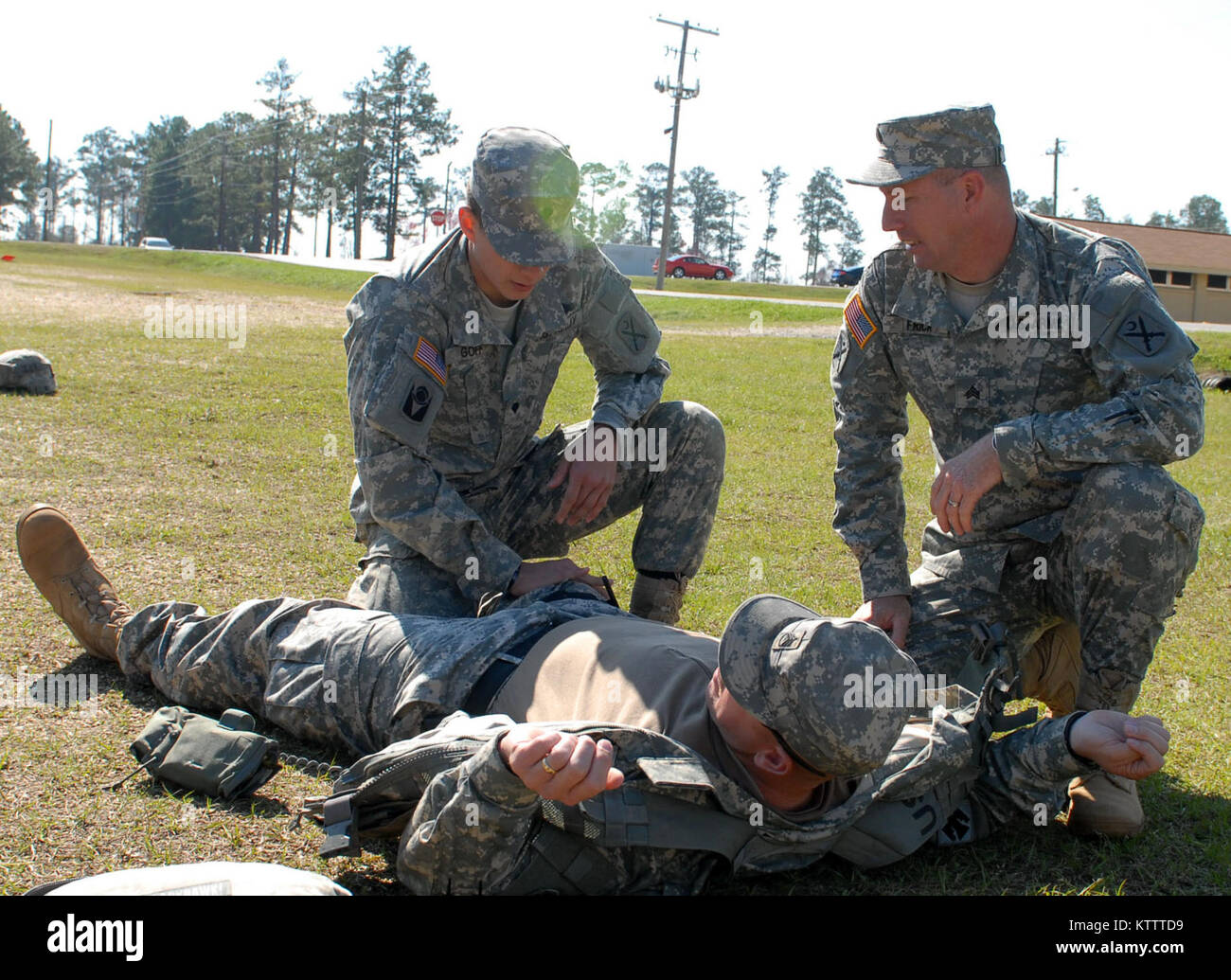 CAMP SHELBY, MS -- Soldiers of A Company, 4-118th Infantry Battalion treat mock casualties during a Combat LifeSaver class here Feb. 9. Combat Lifesavers are non-medical Soldiers who provide lifesaving measures as a secondary mission as their primary and combat missions allow. The battalion is part of the 27th Infantry Brigade Combat Team, and brigade troops are here preparing to deploy overseas. (photo by Sgt. First Class Raymond Drumsta, 27th IBCT Public Affairs) Stock Photo