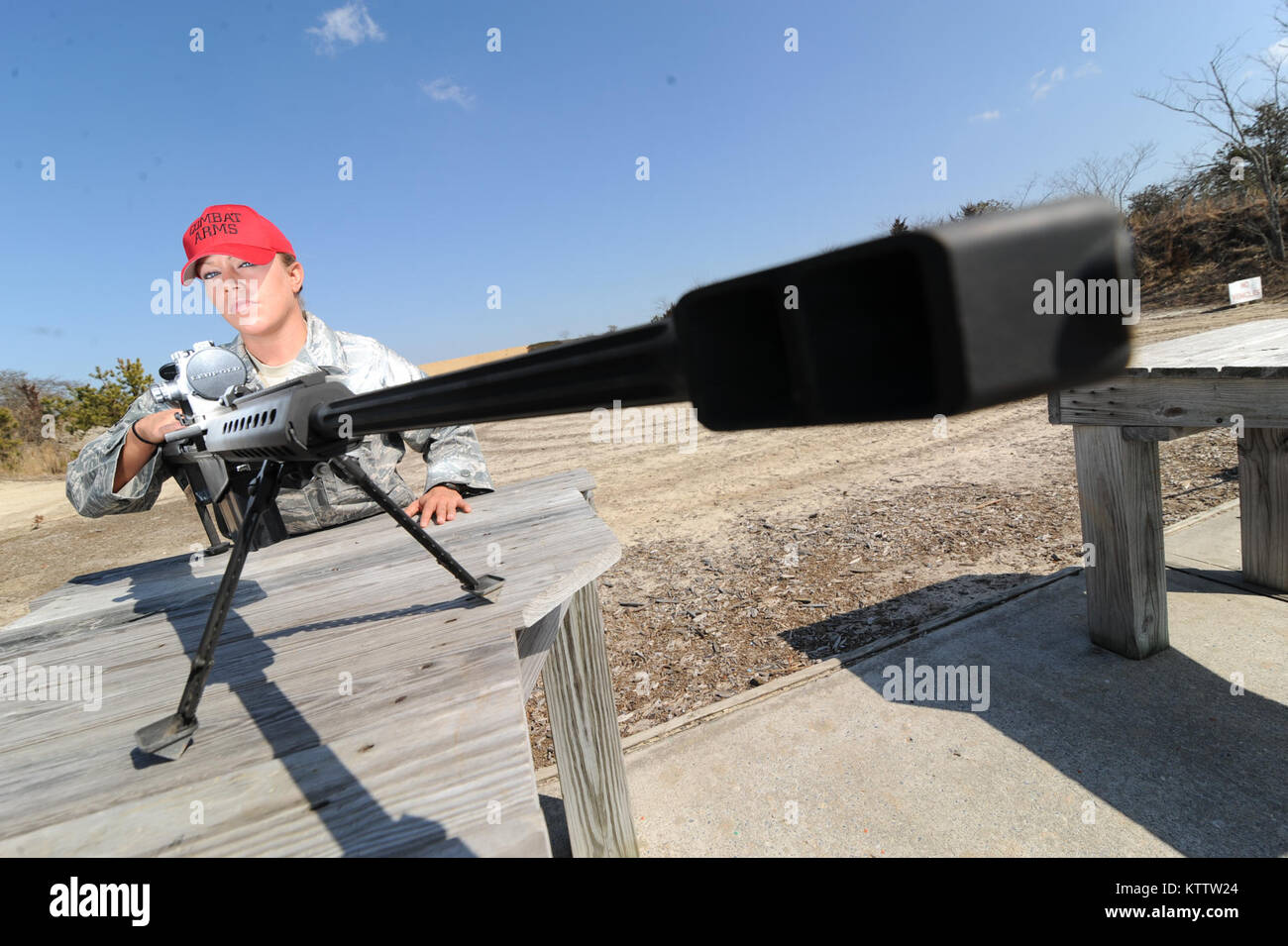 WESTHAMPTON BEACH, NY - Senior Airman Tara Langella sights a .50 caliber sniper rifle at F.S. Gabreski ANG on March 14, 2012. Stock Photo