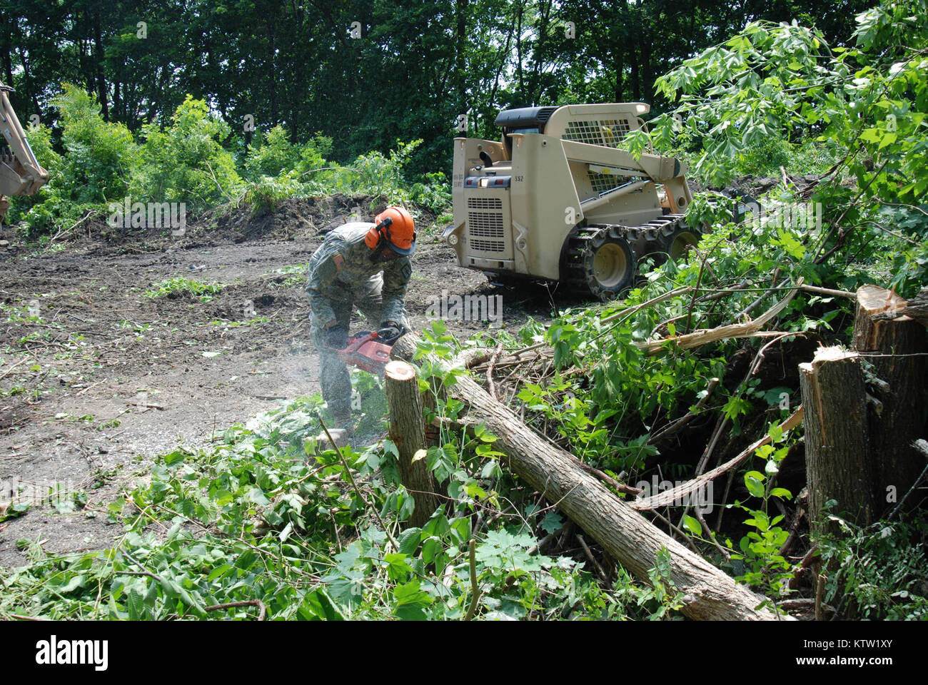 COHOES, N.Y. - Soldiers from New York Army National Guard's 1156th Engineer Battalion and 152nd Engineer Company leveled trees and removed tons of underbrush in the ruins of the Erie Canal located in the center of the City of Cohoes on June 11 as part of a trail-clearing process. The Soldiers were conducting innovative readiness training as part of their Annual Training.  Photo by Sgt. 1st Class Steven Petibone, New York Army National Guard Stock Photo