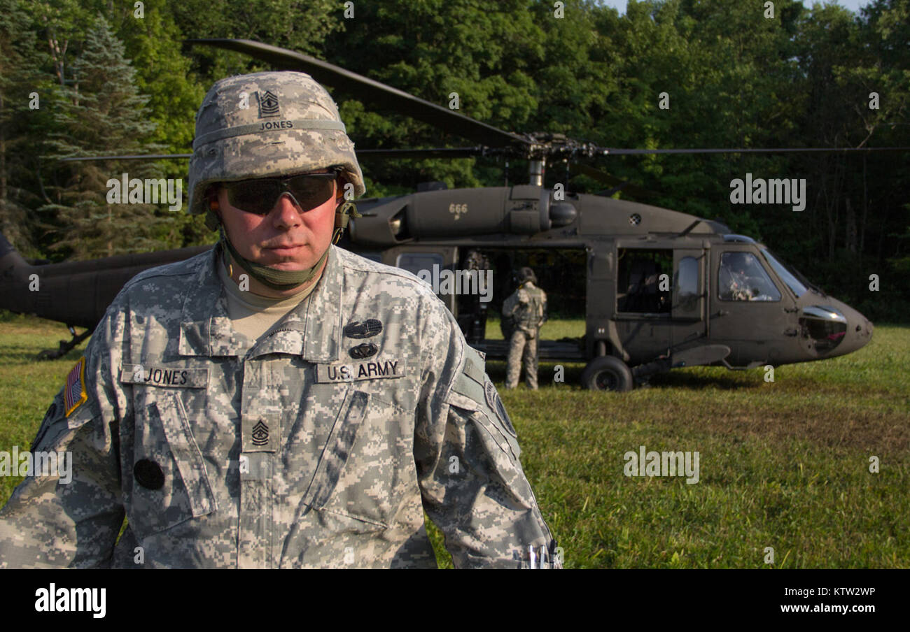 MARCY, NY- Sgt. Major  Wiley Jones from the 401st Civil Affairs Battalion, US Army Reserve, walks away from a UH-60 Blackhawk from Company F, 1-169th General Support Aviation Battalion of the New York Army National Guard, after a flight during a Medevac exercise conducted here on Thursday, July 12.  Photo by SPC Harley Jelis, HHC 42nd CAB, NYARNG Stock Photo
