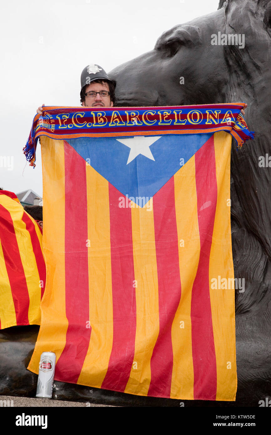 Barca fans in Trafalgar Square before the kick-off of the Champions League Final between FC Barcelona and Manchester United. Barca Fan holds up blue Estelada flag, which is typically waved by Catalans supporting independence from Spain. Stock Photo