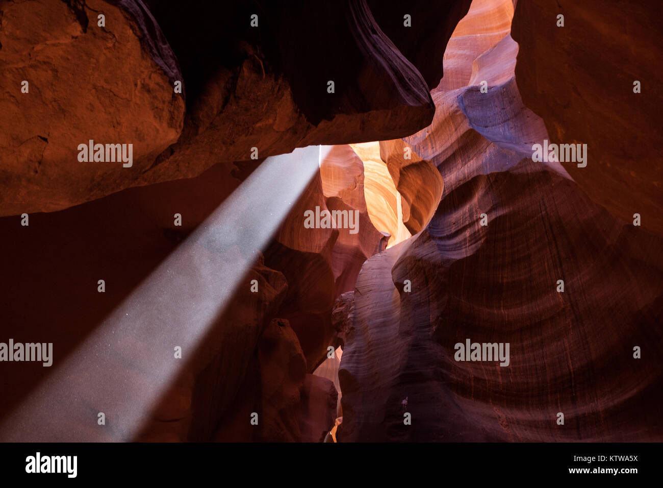 PAGE, ARIZONA, USA. - APRIL 2015: A light ray breaks thru an opening in Antelope Canyon. Stock Photo