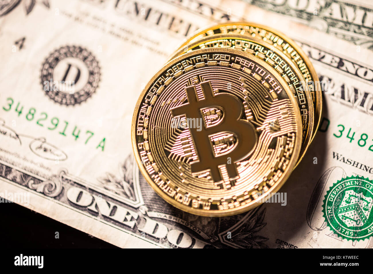 Bitcoins on outdated obsolete dollar bills, old vs new Stock Photo Alamy