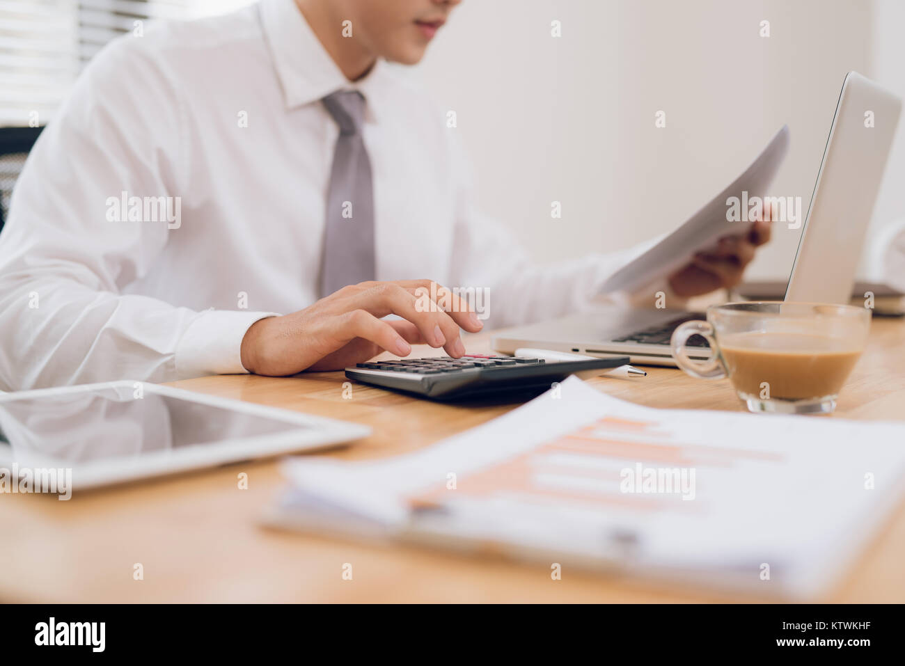 Close up of hands of business man working on laptop.Blank screen for graphic display montage. Stock Photo