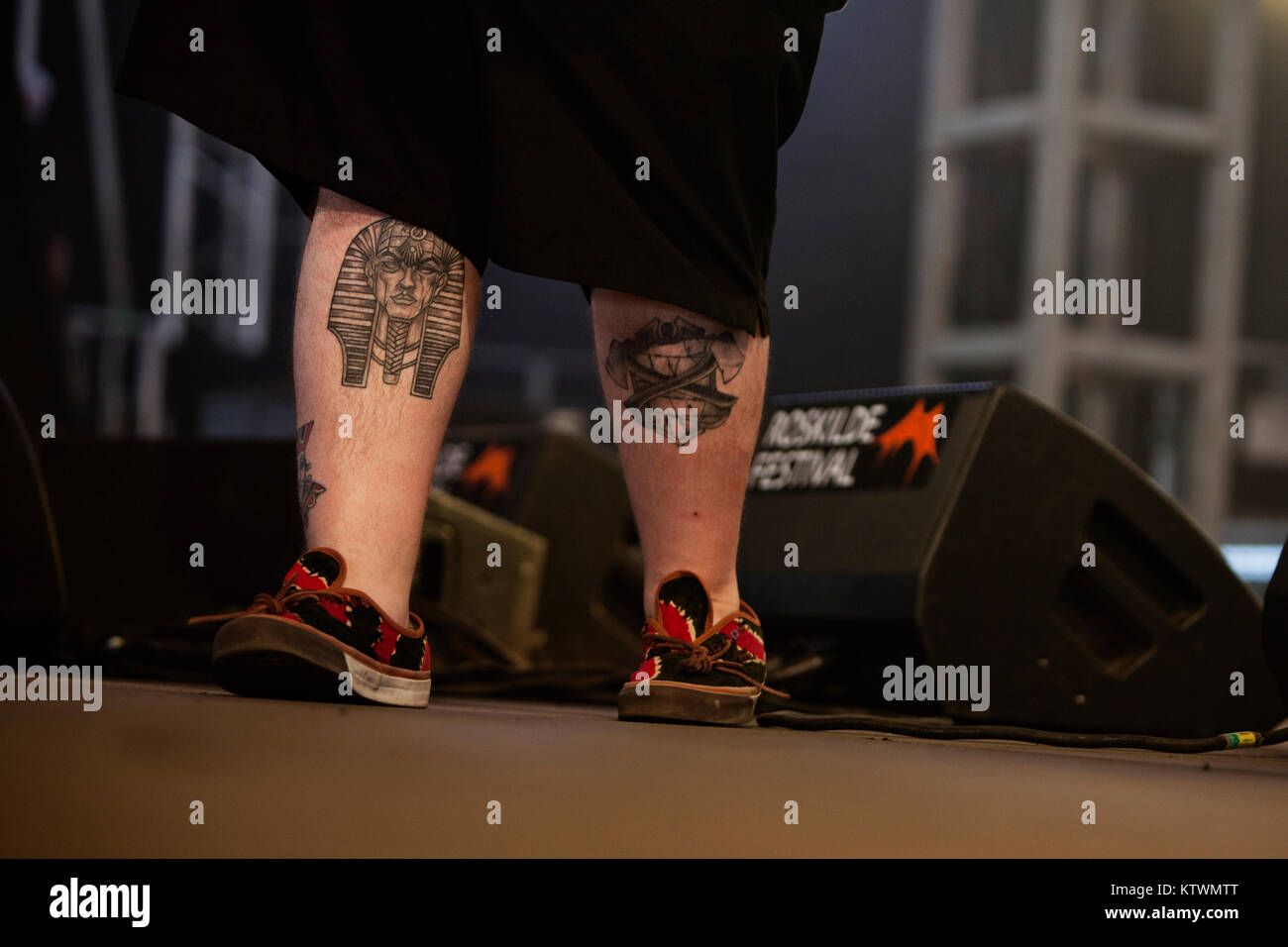 Rappers are mostly tattooed and the American rapper Action Bronson is no exception. He has tattoos all over his body like here on his legs. Denmark 2013. Stock Photo