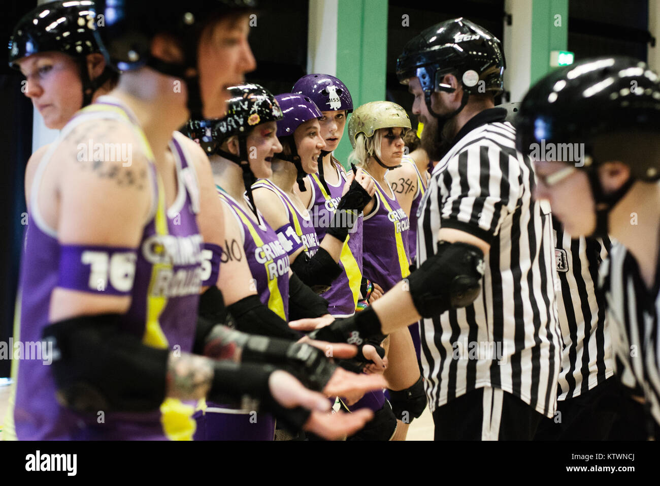 Roller Derby players in their roller skates getting ready for the next
