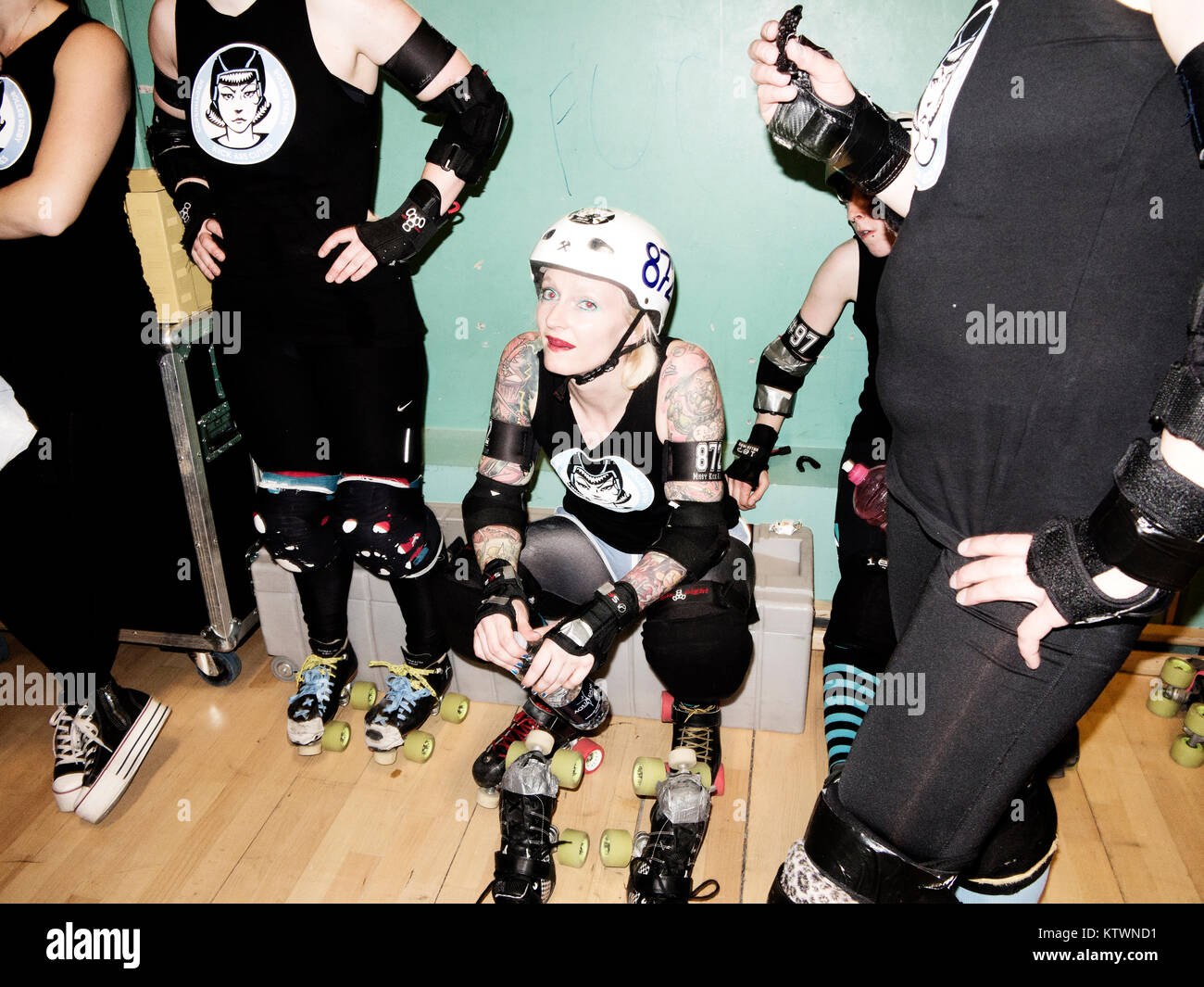 Roller Derby team players in their roller skates getting ready for the