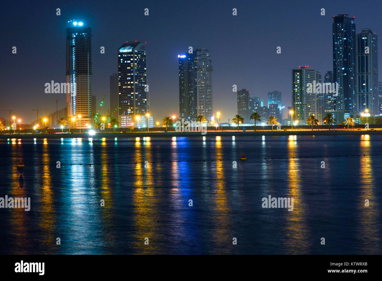 Dubai,UAE. A view from one of the beach with beautiful buildings allowing magnificent light reflection and light trail on the road beside the beach. Stock Photo