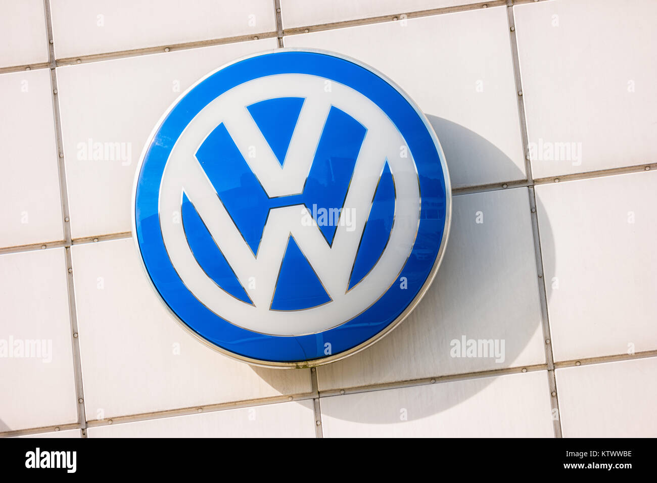 Volkswagen VW sign on a store facade. Volkswagen is a famous European car manufacturer company based on Germany Stock Photo