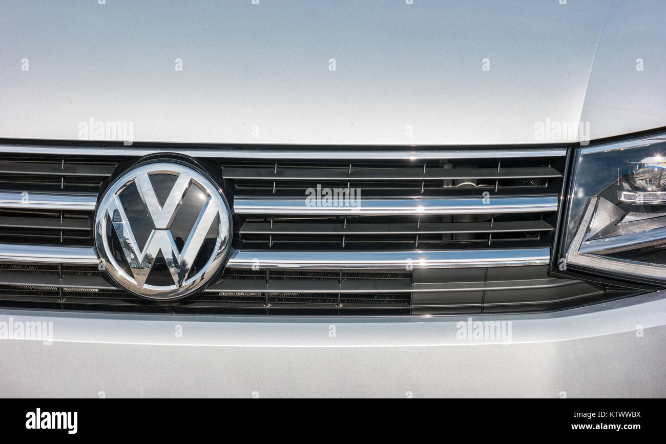 Volkswagen VW logo on a silver car. Volkswagen is a famous European car manufacturer company based on Germany Stock Photo