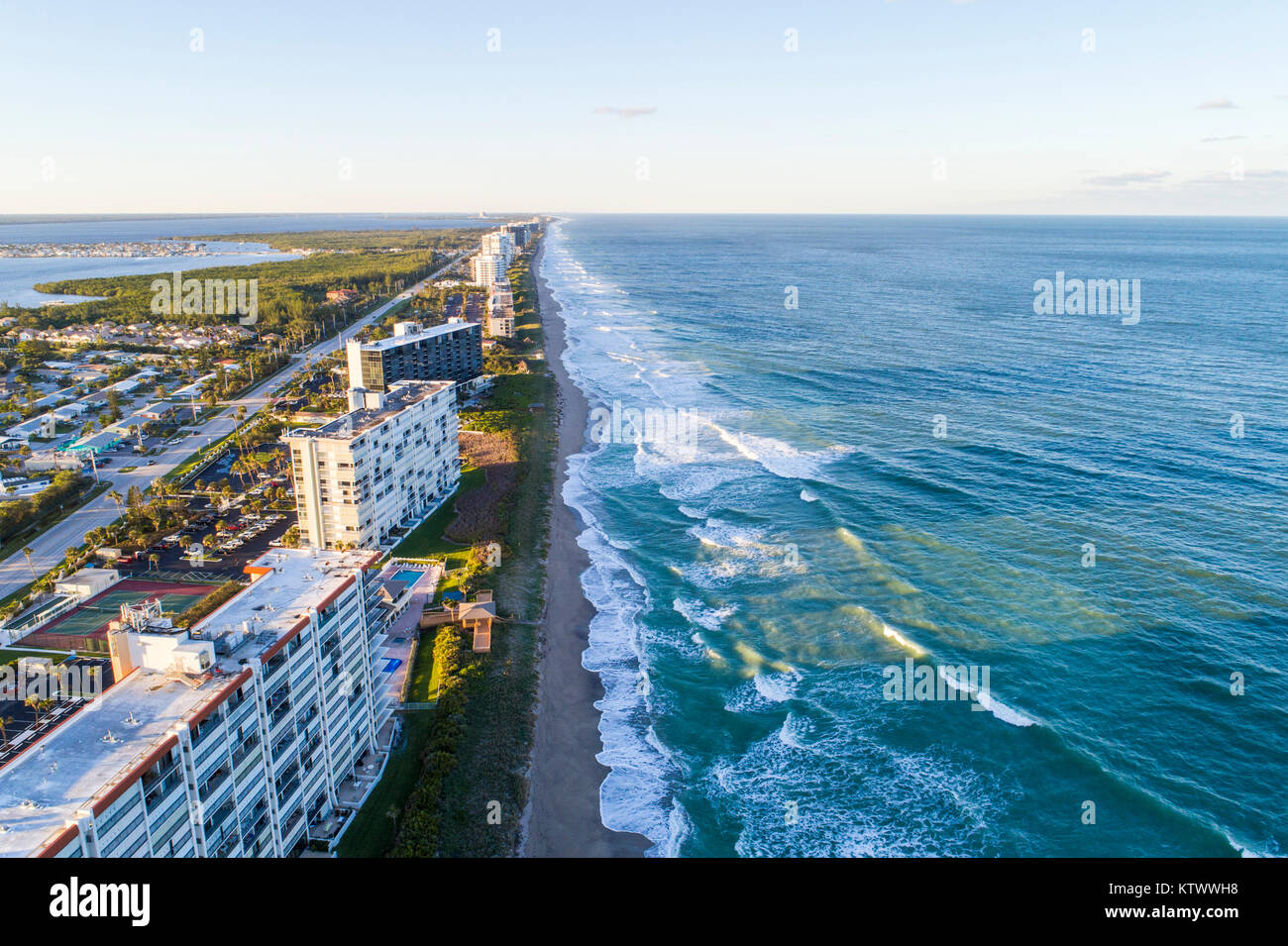 Florida Hutchinson Barrier Island,Jensen Beach,barrier island,Atlantic Ocean,water surf waves,high-rise condominium residential apartment apartments b Stock Photo