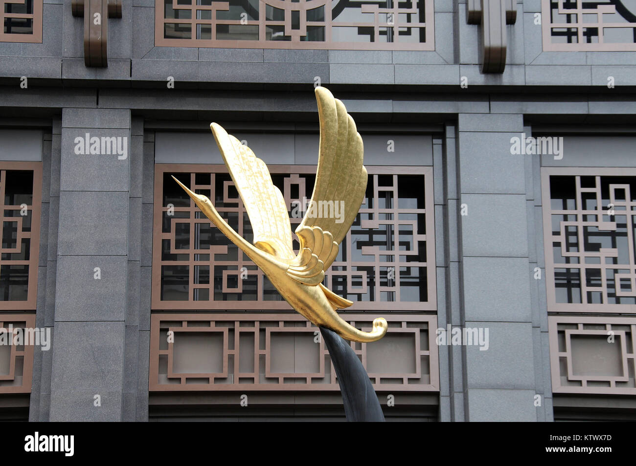 Golden Crane at Parkview Square in Singapore Stock Photo