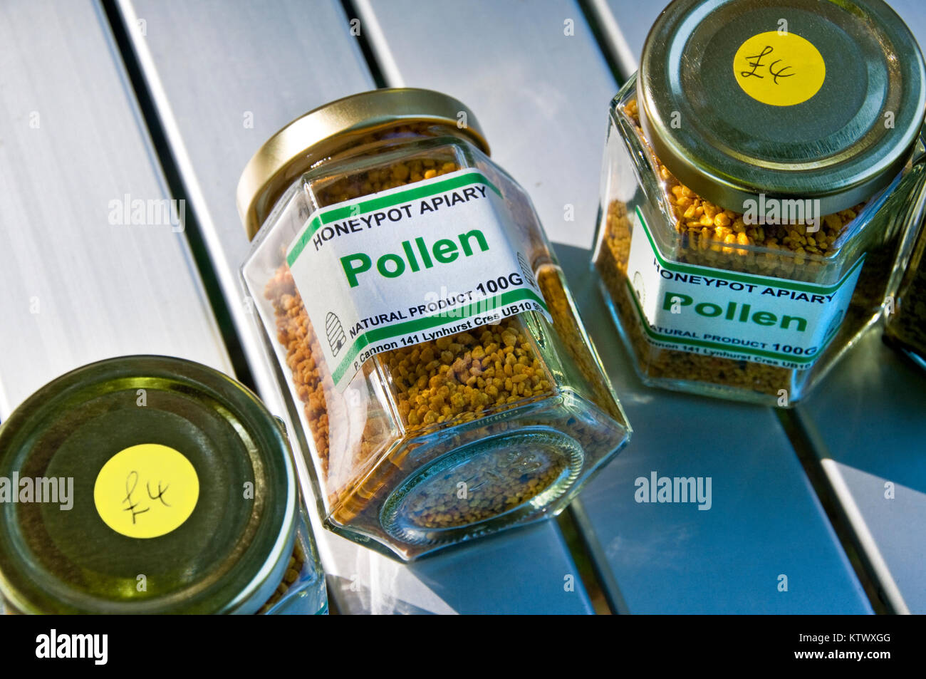 Jars of Pollen health food supplement for sale at £4 each, readily digestible and highly nutritious food produced as a by-product by honey bees Stock Photo