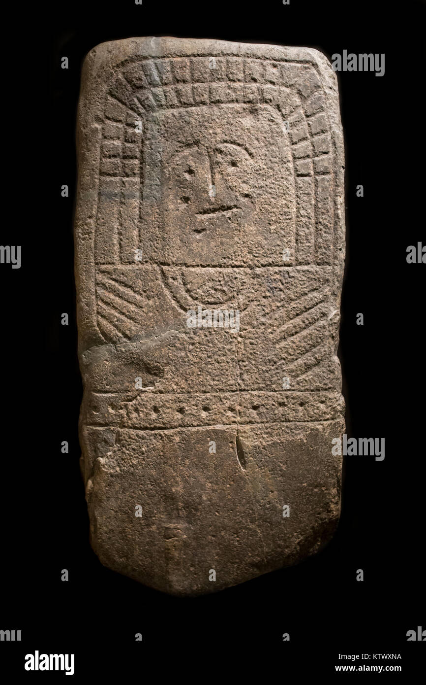 Madrid, Spain - November 11, 2017: Stela of Hernan Perez VI. Drawing on the rock belonging to Early-Middle Bronze, Caceres. National Archeological Mus Stock Photo