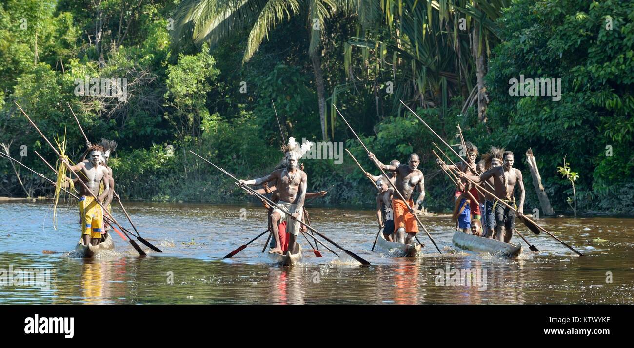 Canoe war ceremony of Asmat people. Headhunters of a tribe of Asmat