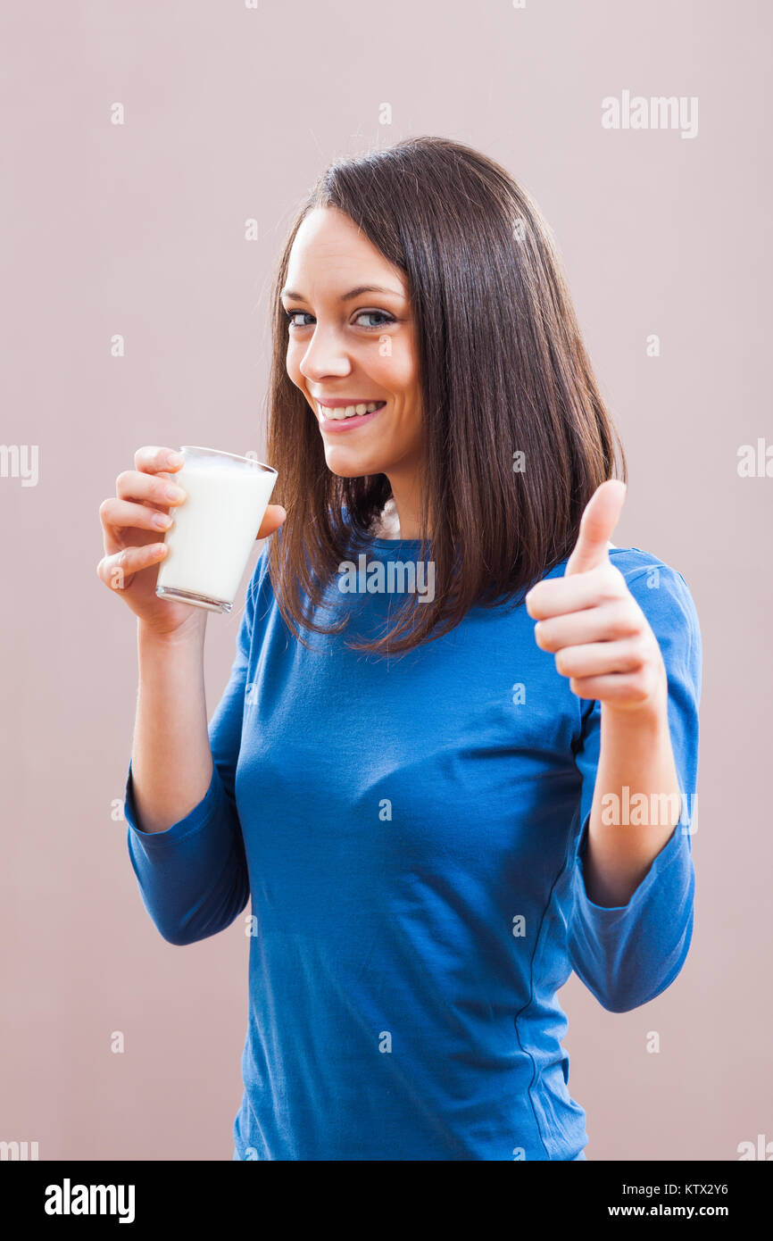 Young woman is drinking milk. Healthy nutrition Stock Photo Alamy
