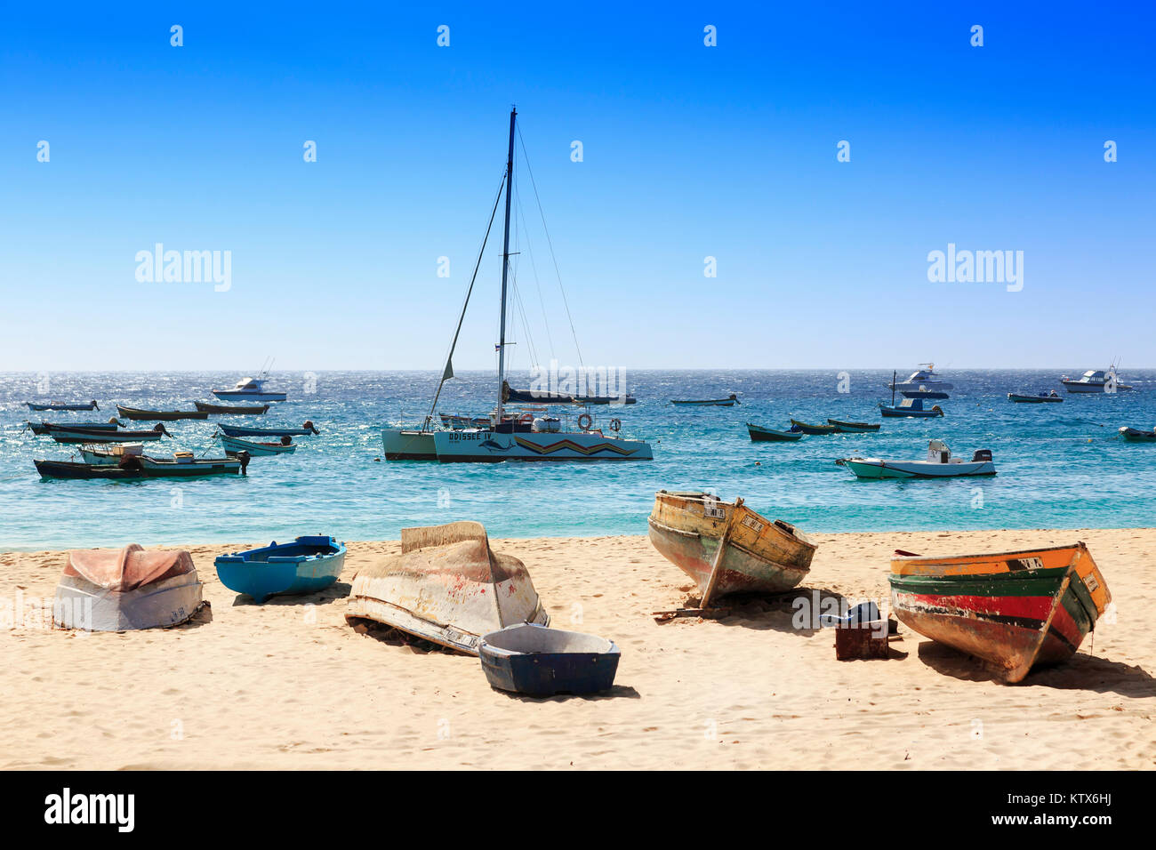 Selection of traditional wooden fishing boats and yachts in the bay at Santa Maria, Sal Island, Salina, Cape Verde Stock Photo