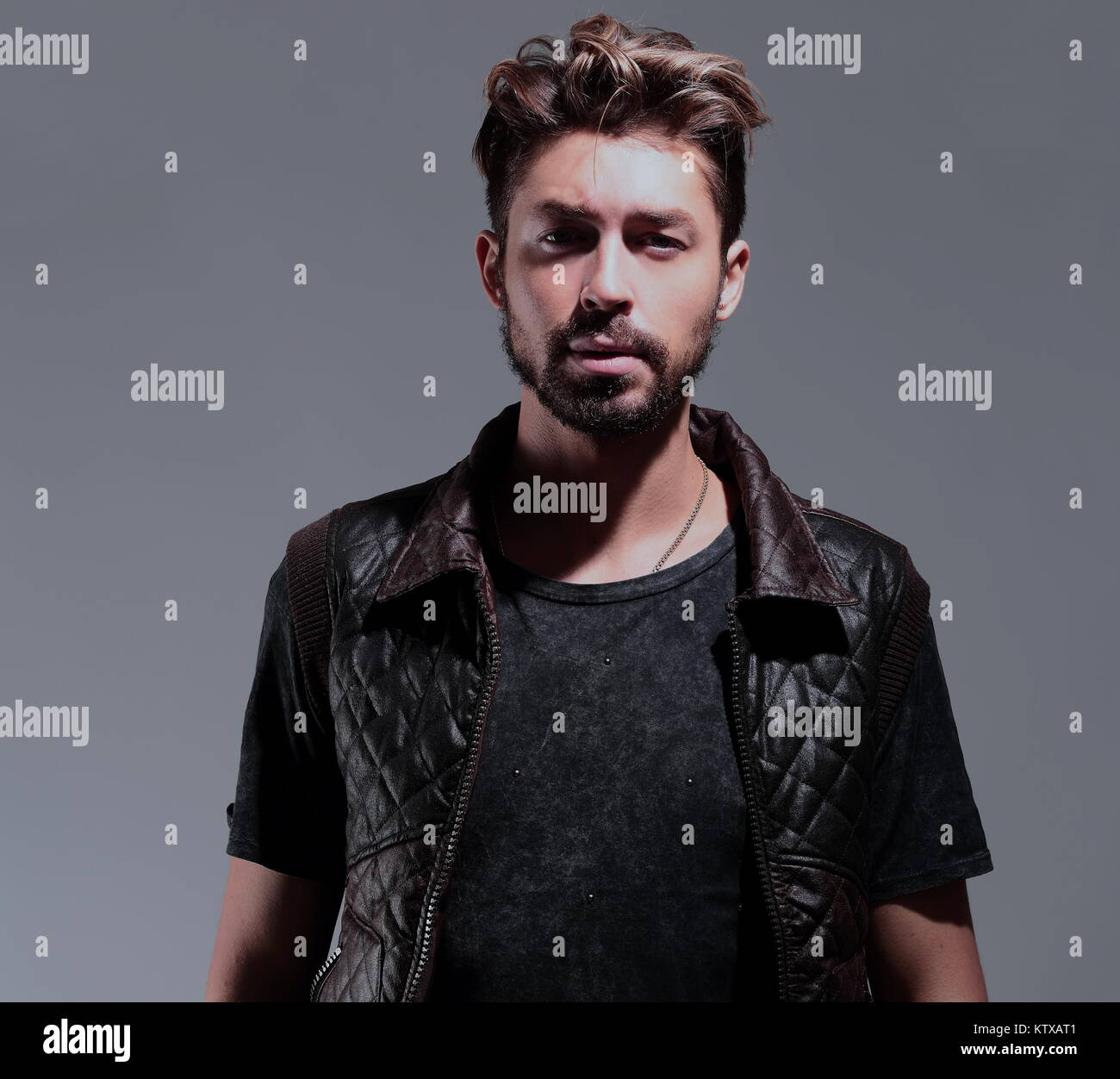 Portrait of a pensive handsome man over gray background Stock Photo - Alamy