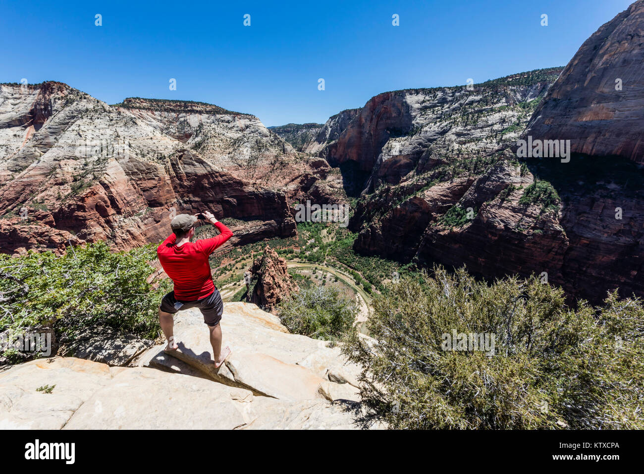 Photographer shooting the valley floor from Angel's Landing Trail in