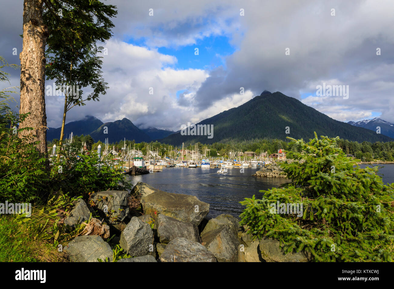 Crescent Boat harbour with beautiful wooded mountains and town of Sitka, rare sunny day, summer, Baranof Island, Alaska, United States of America, Nor Stock Photo