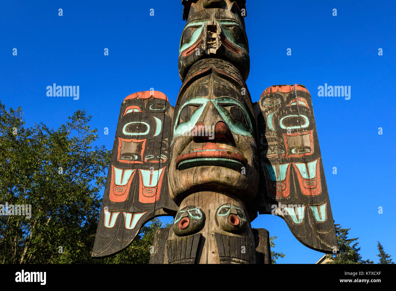 Chief Johnson Tlingit totem pole, beautiful sunny summer day, Ketchikan, Southern Panhandle, Southeast Alaska, United States of America, North America Stock Photo