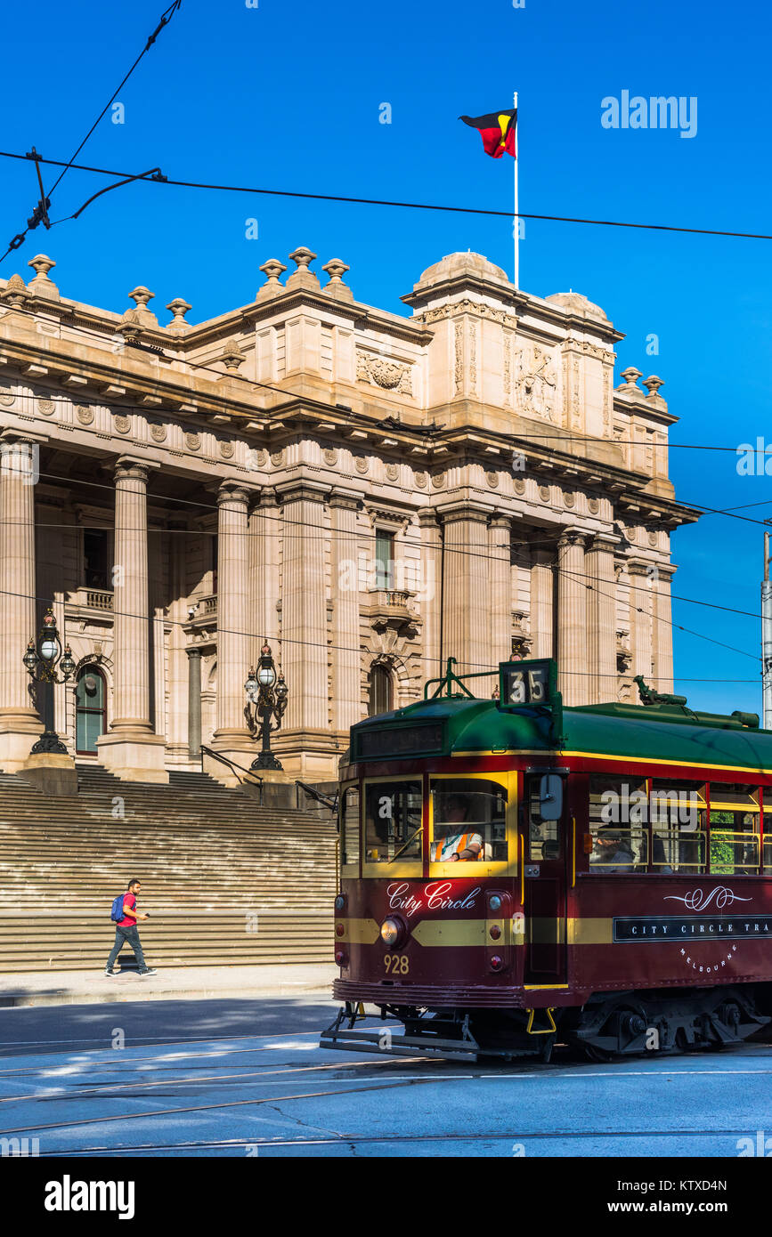 A classic tram goes past Parliament House in Melbourne, Victoria, Australia, Pacific Stock Photo