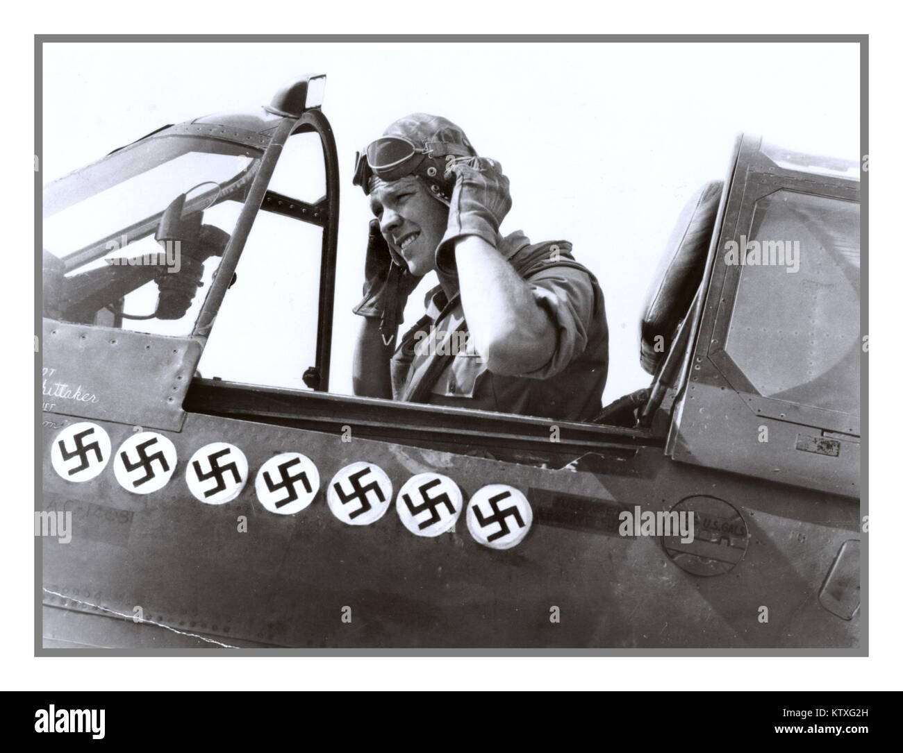 USAAF Renowned U.S. pilot Roy Whittaker, 57th Fighter Group, in the cockpit of his P-40 fighter. April 18, 1943 at Cape Bon (Tunisia). The seven swastikas painted on his plane mark the number of German aircraft Roy Whittaker had shot down by April 1943 Stock Photo